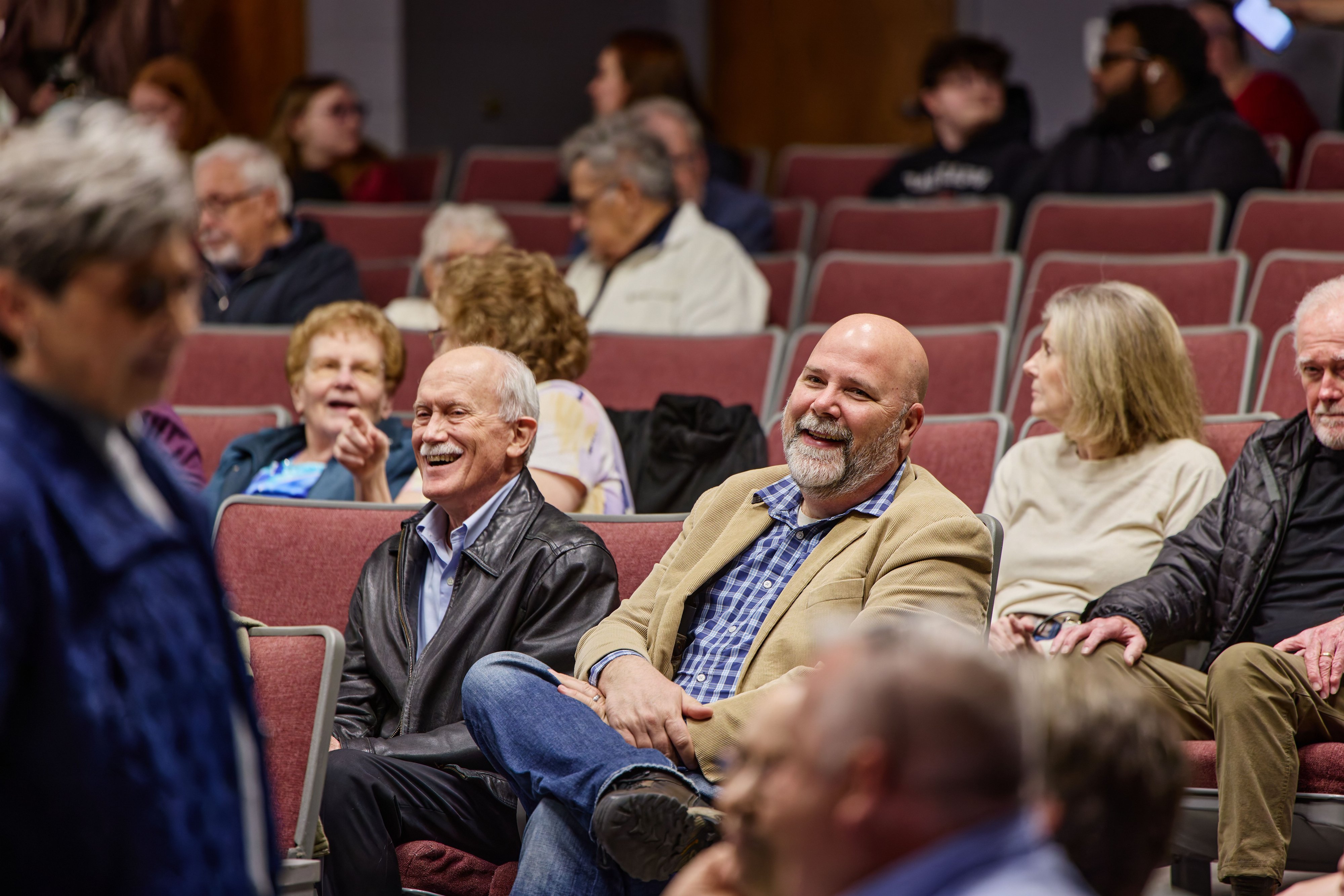 Guests smiling in the audience at a Reagan Society event