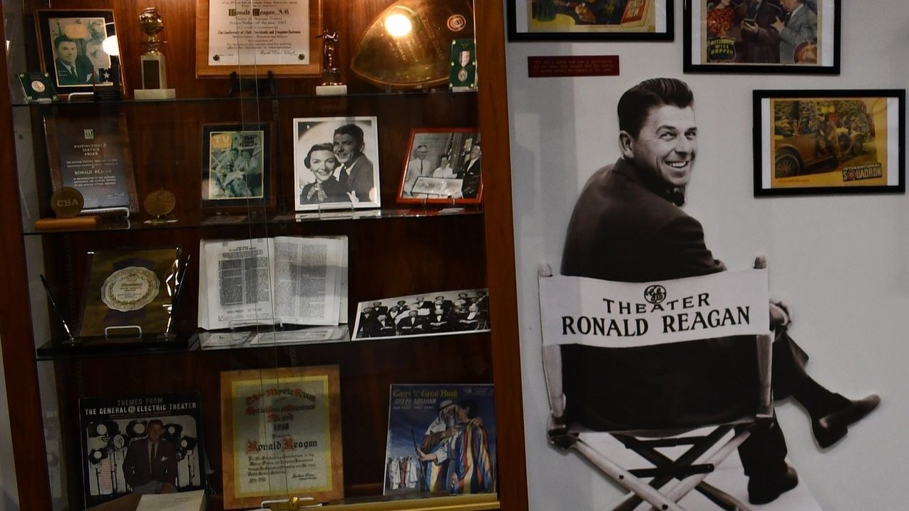 Framed photographs and display cases inside the Ronald W. Reagan Museum